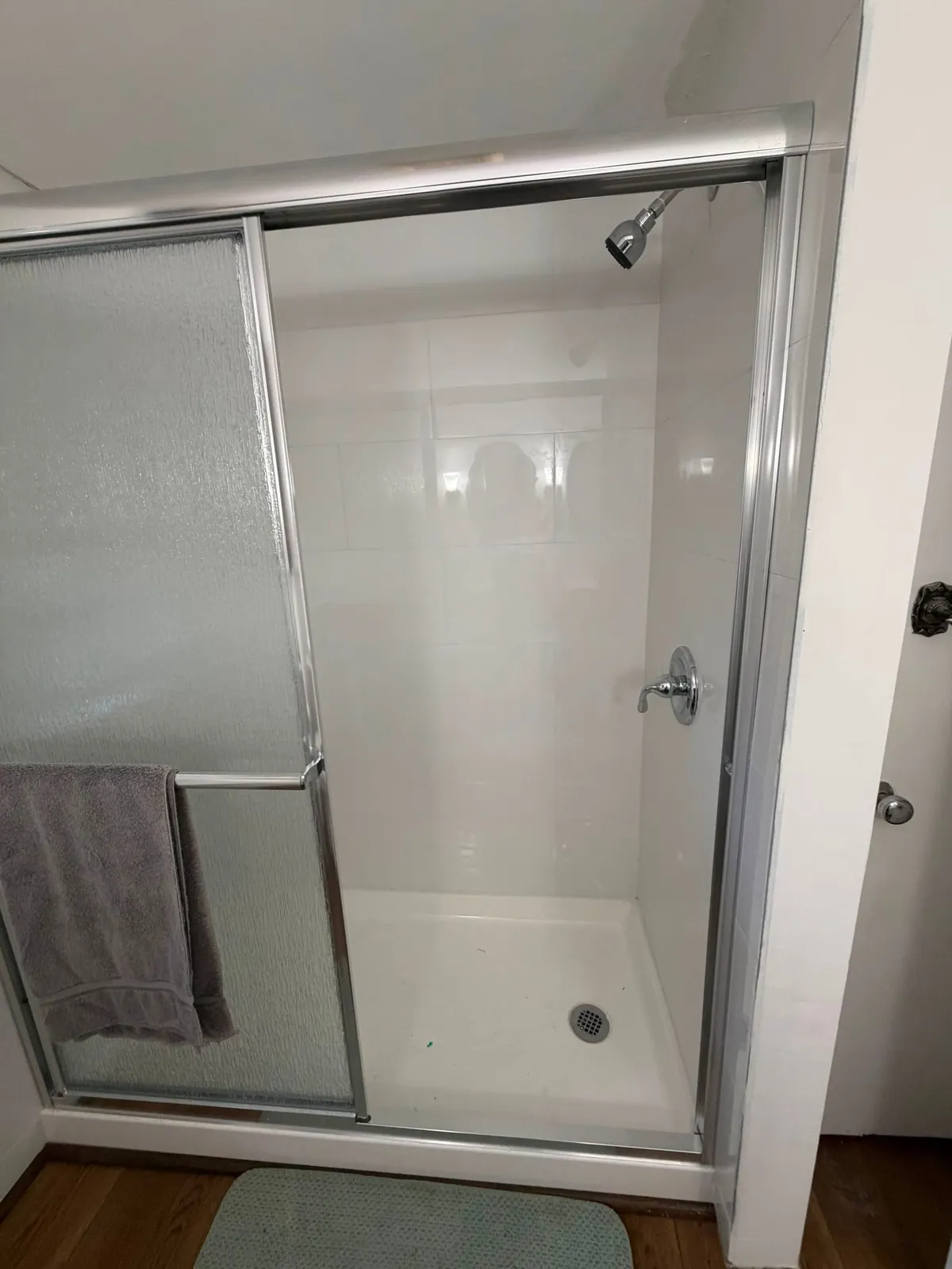 New tiled walk-in shower after bathroom remodel