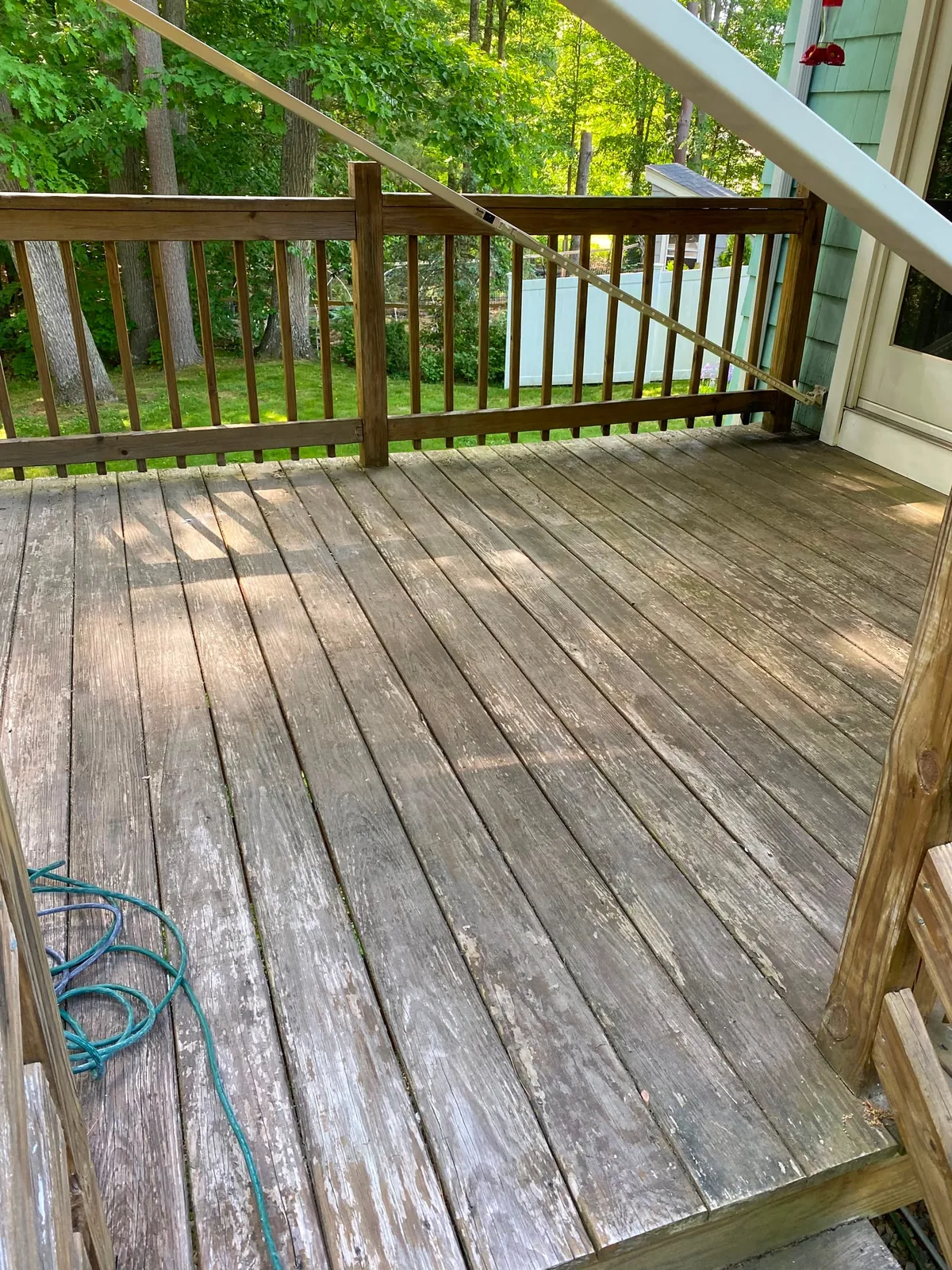Weathered gray deck before refinishing